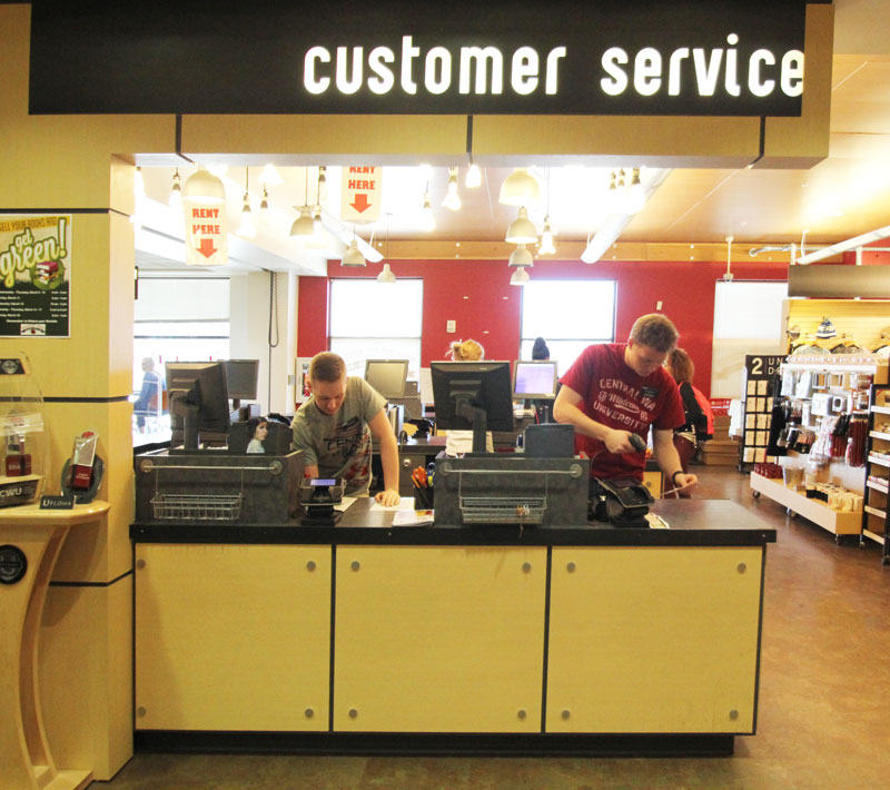 Wildcat Shop employee assisting a customer